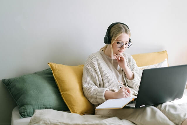 Photo of woman sitting with laptop for personal development blog post